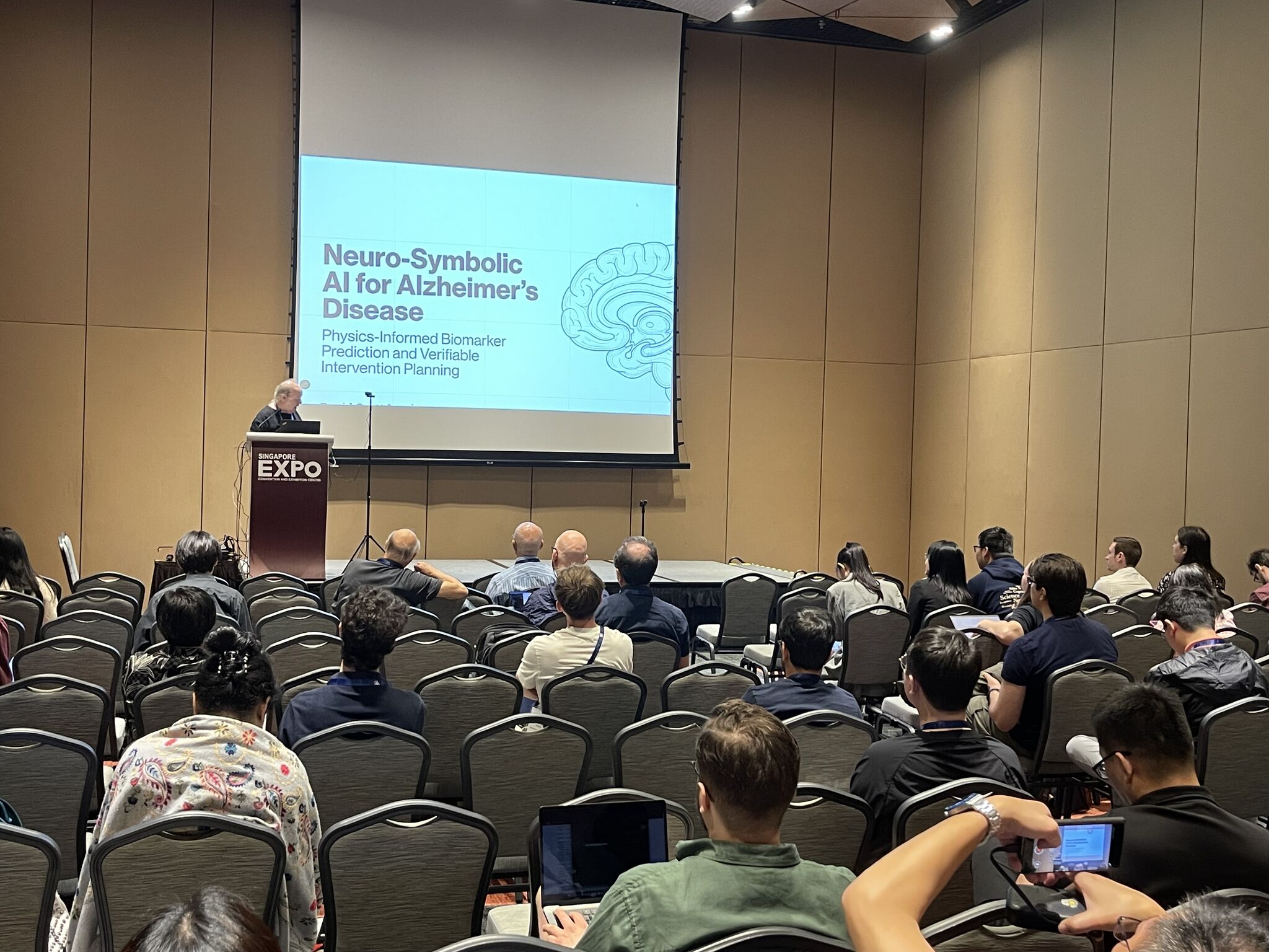 David Scott Lewis presenting Neuro-Symbolic AI for Alzheimer's Disease at AAAI-26 Singapore Expo